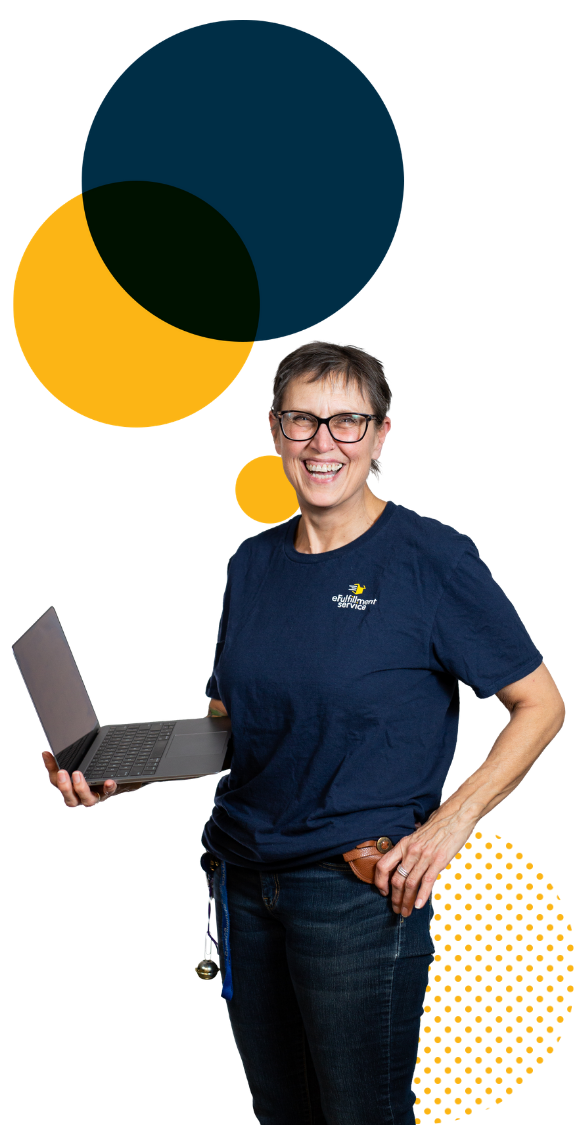 eFulfillment Service employee smiling with laptop and large dots