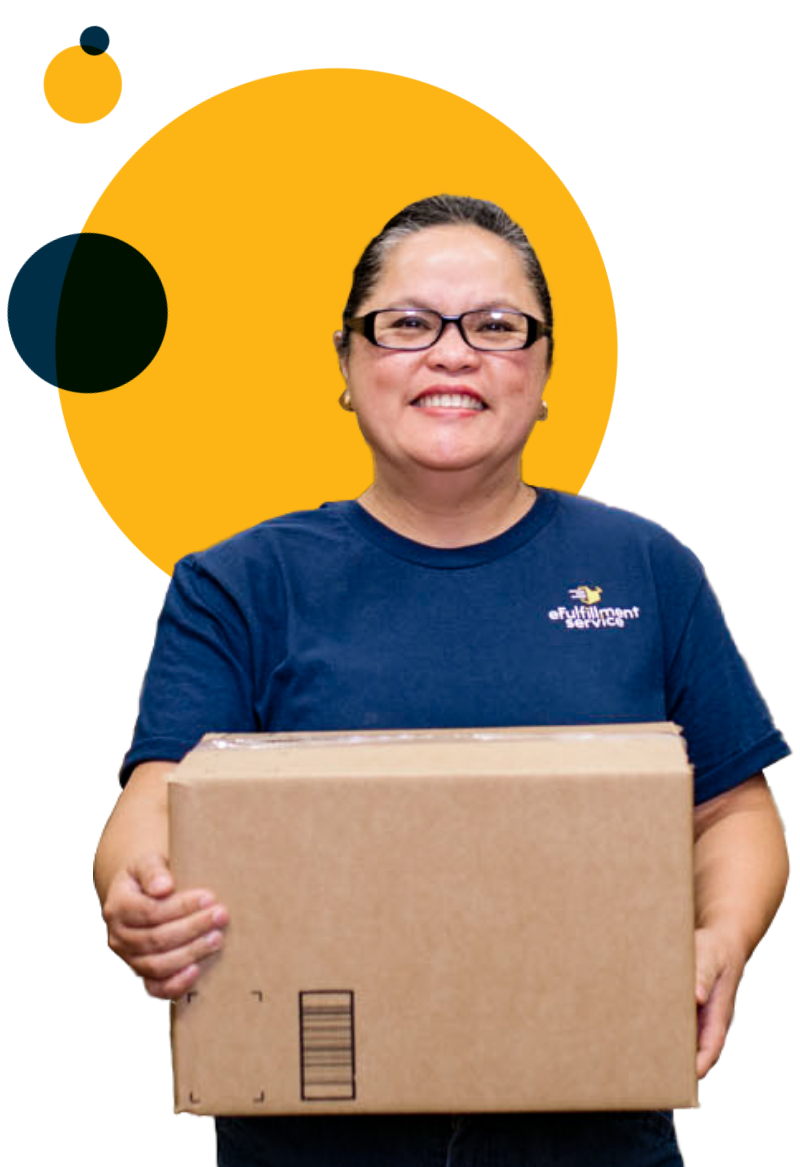 eFulfillment Service Employee Smiling with Box Wearing Glasses