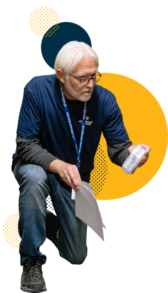 eFulfillment Service Older Man Kneeling With Papers and Product Dots
