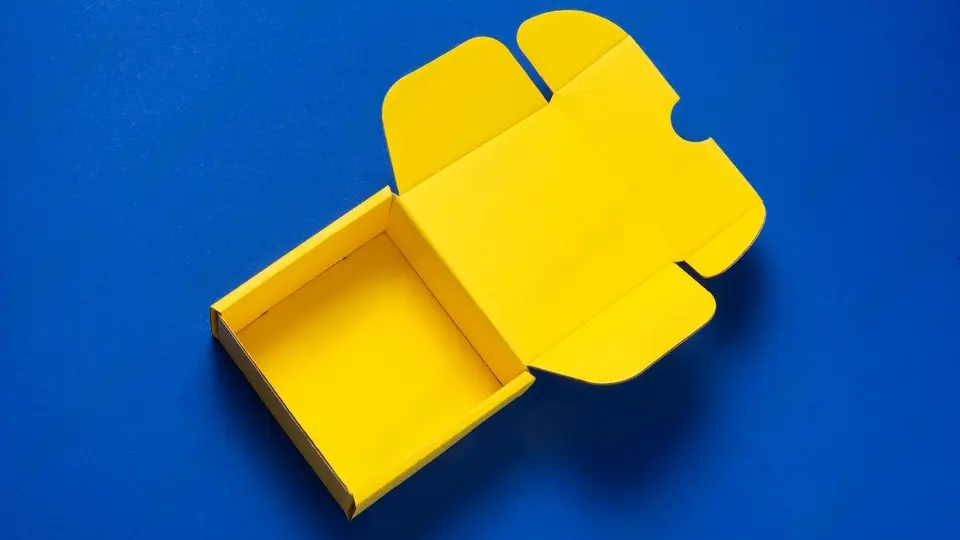 yellow custom packaging box on blue background