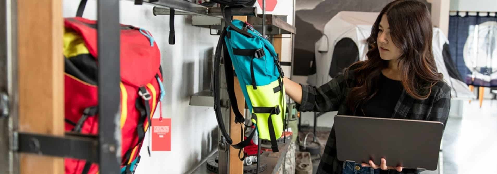 women-holding-backpack-on-display