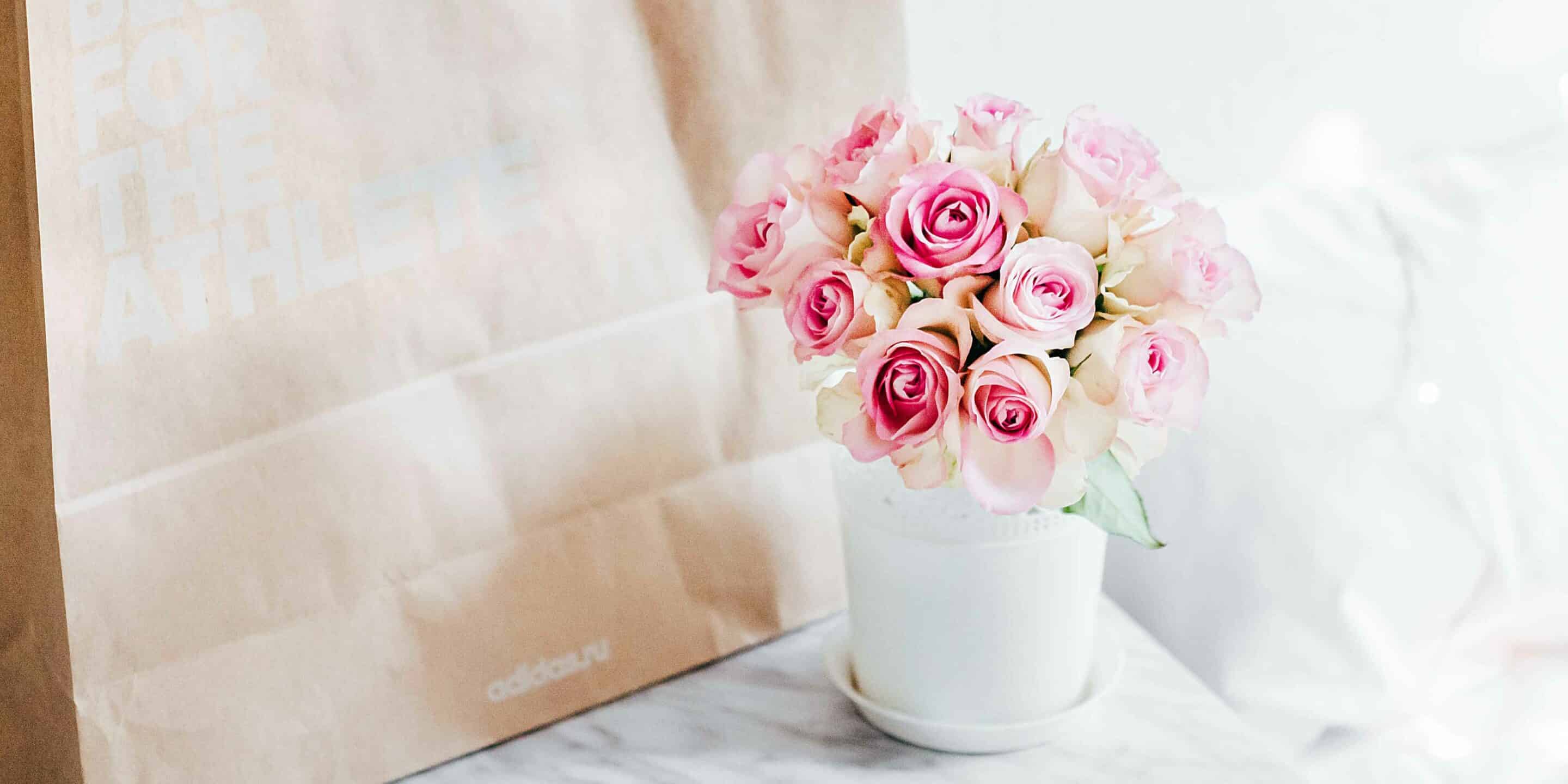 mothers day flowers next to a craft paper bag