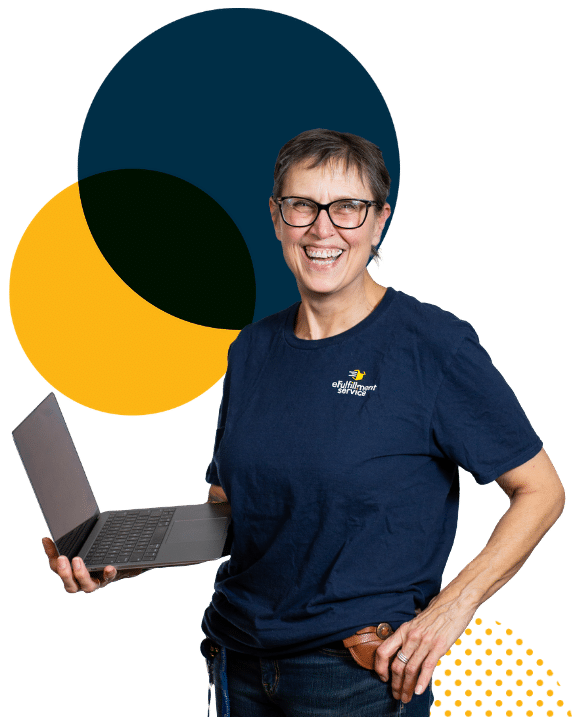 eFulfillment Service employee smiling with laptop and large dots