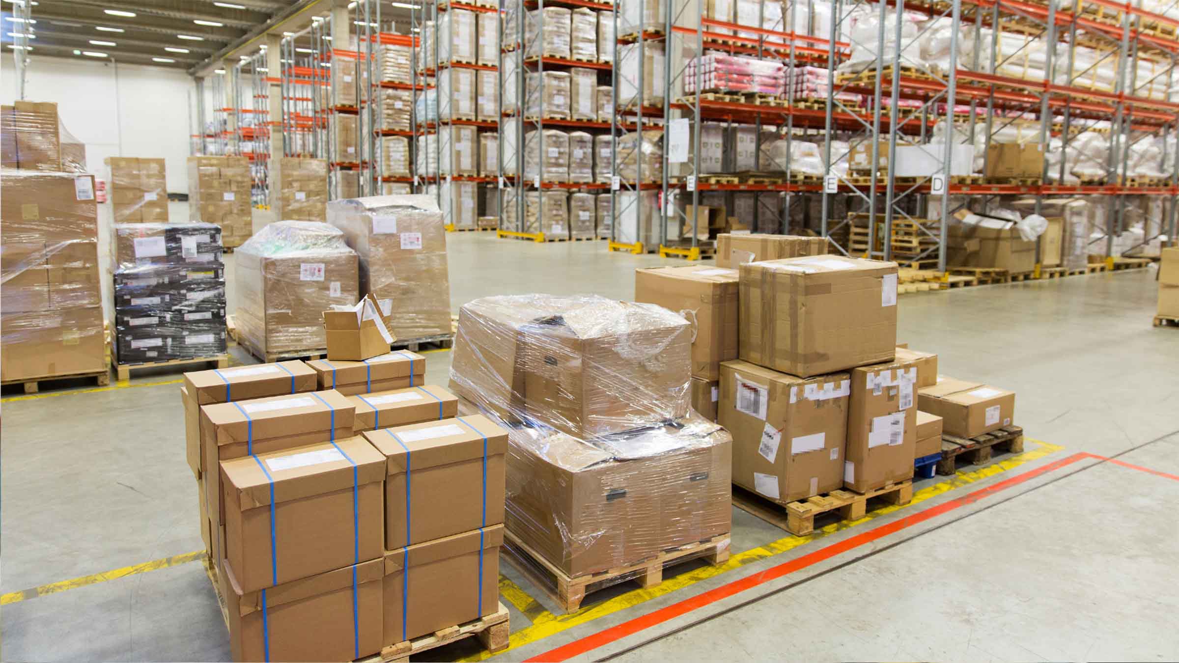 image of damaged goods and boxes inside of a warehouse on a pallet