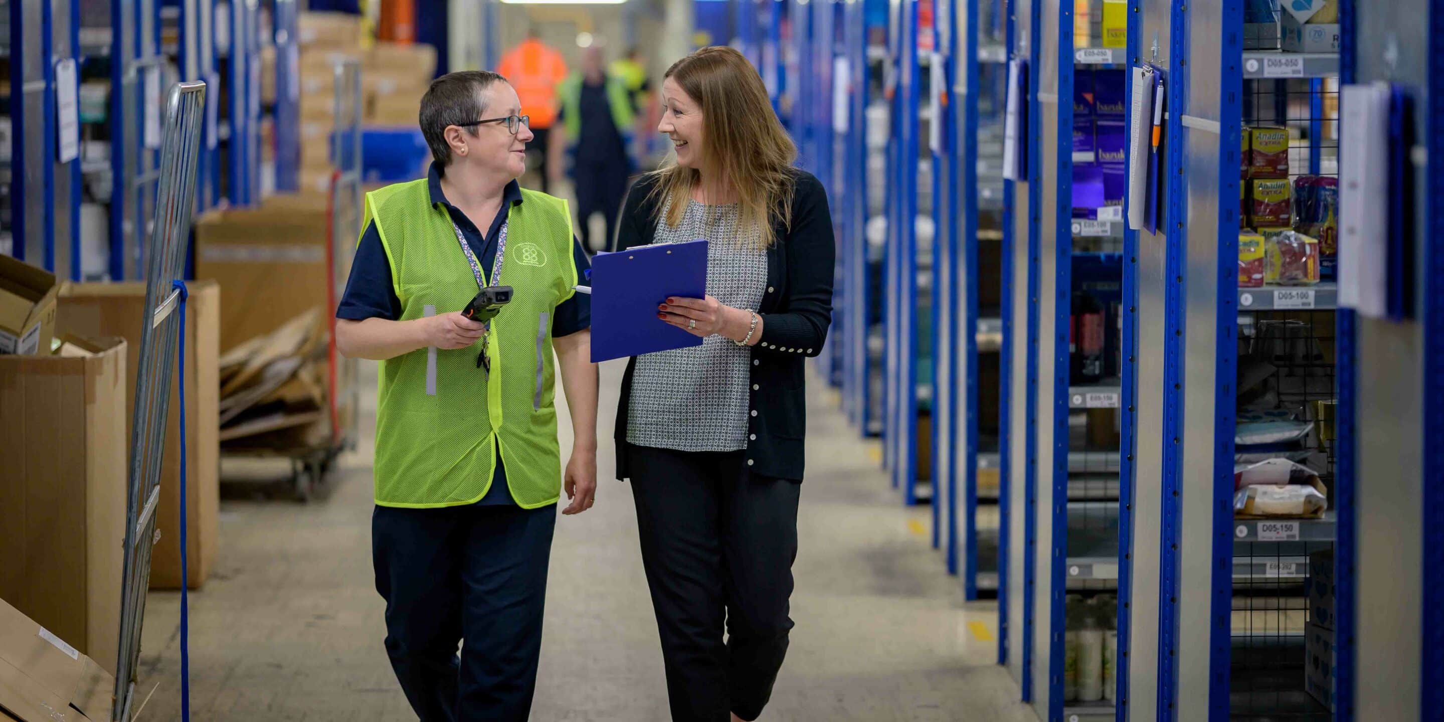 image of employees walking through warehouse