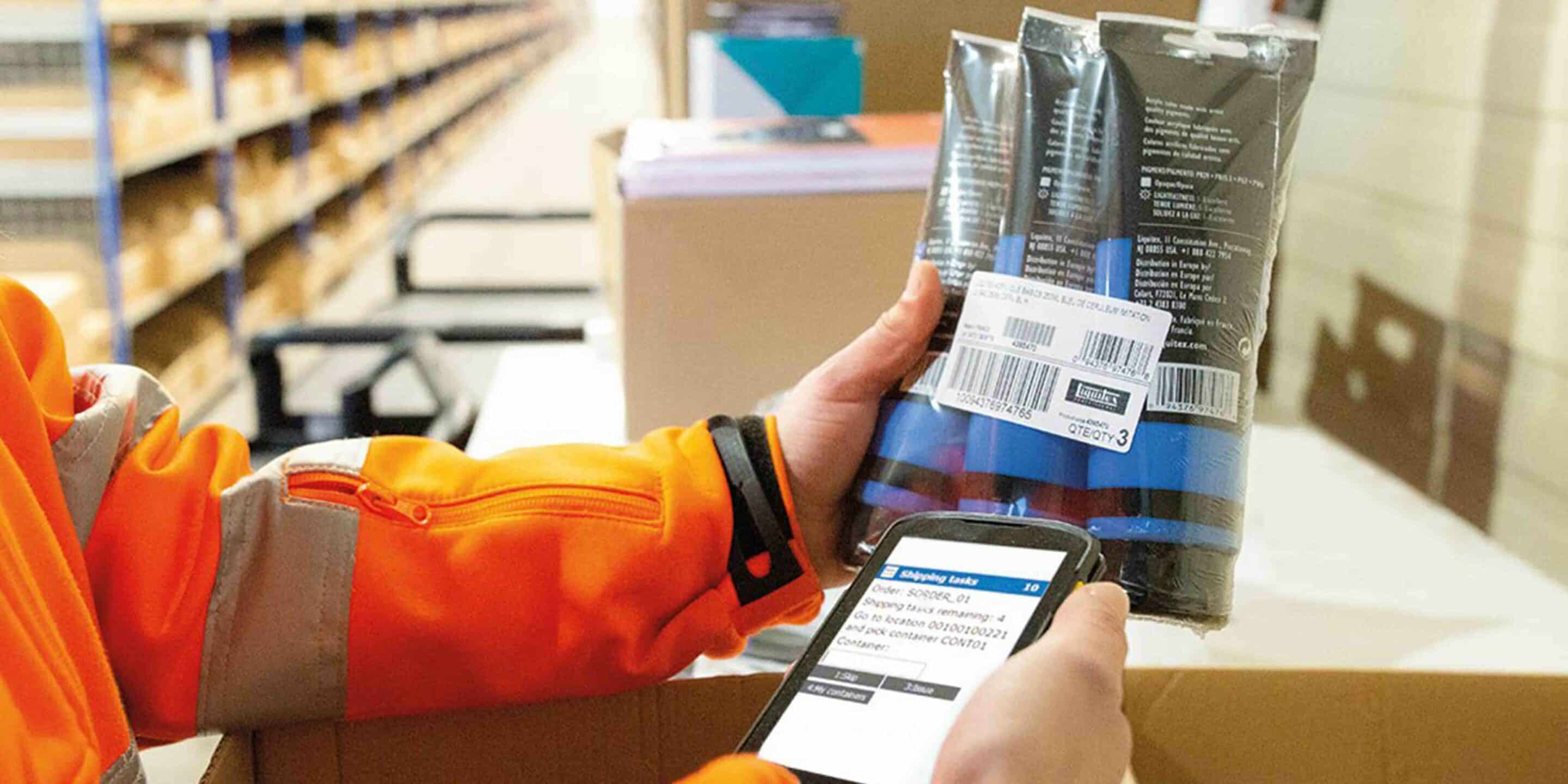 image of employee scanning label of product in warehouse