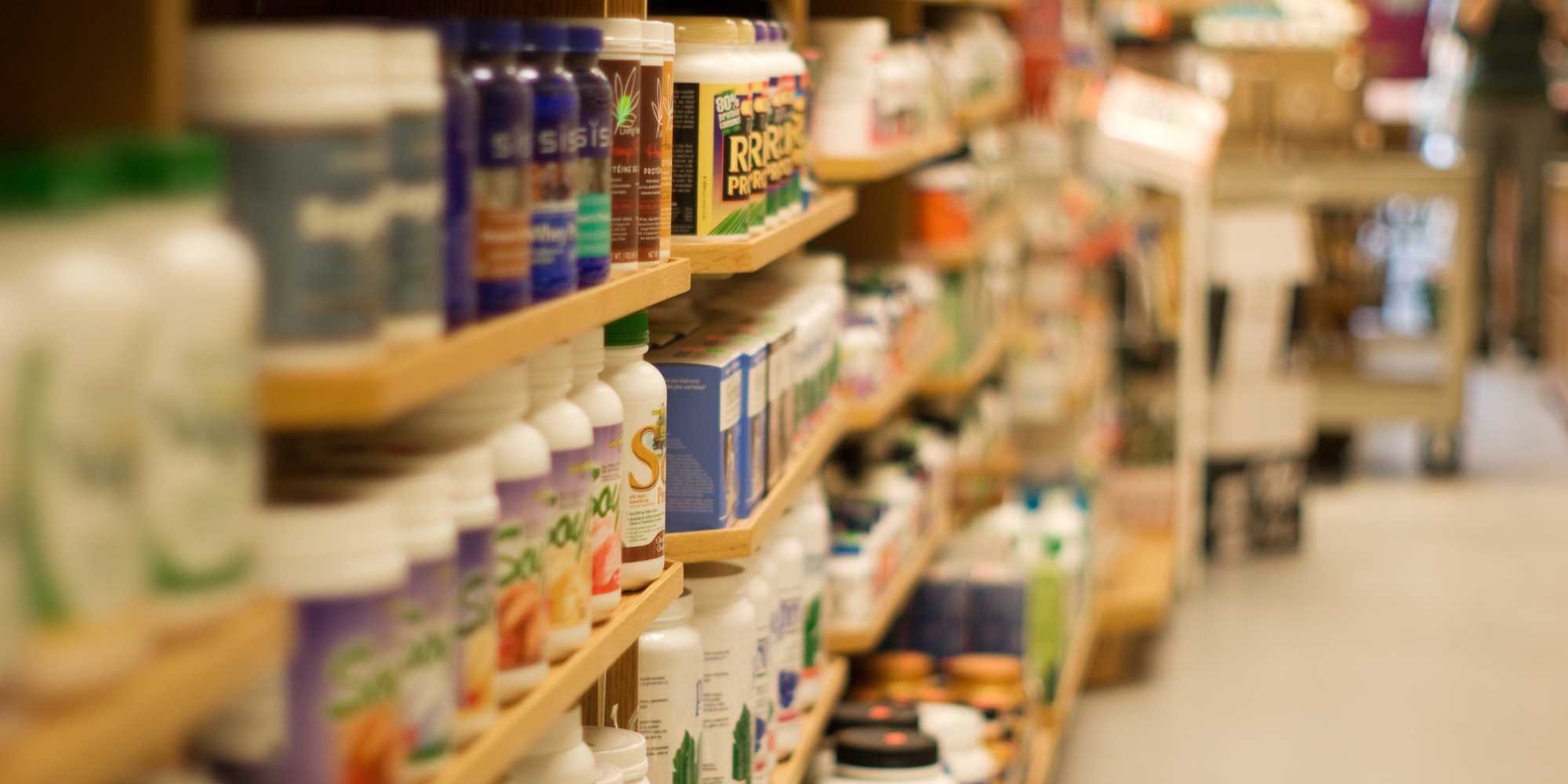 Image of a retail store shelf containing vitamins and supplements.