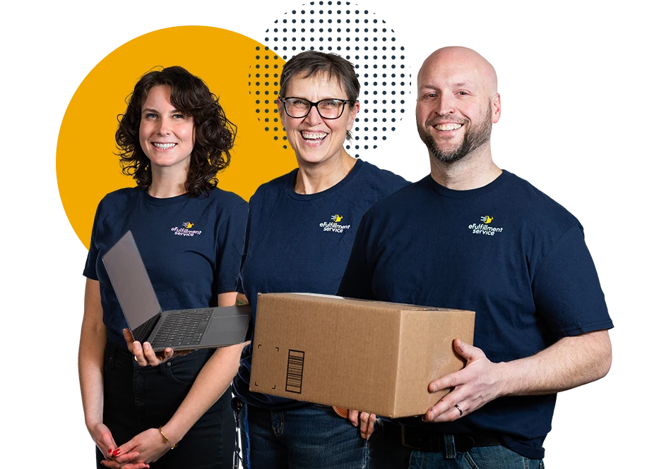 Three eFulfillment Service team members holding a package in the warehouse